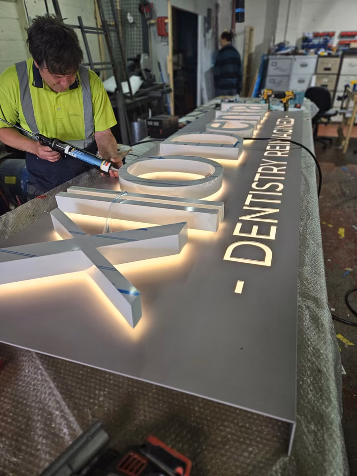 A SignHQ team member manufacturing illuminated letters in the Blackburn workshop